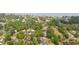 Aerial view of a neighborhood with mature trees at 106 Waterwood Dr, Yalaha, FL 34797