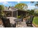 Backyard patio area with outdoor seating, perfect for entertaining and enjoying the beautiful surroundings at 106 Waterwood Dr, Yalaha, FL 34797