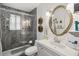 Modern bathroom features a walk-in shower and decorative vanity with a large mirror at 106 Waterwood Dr, Yalaha, FL 34797