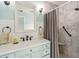 Renovated bathroom showcasing a marble tiled shower with a built-in seat and a sleek vanity at 106 Waterwood Dr, Yalaha, FL 34797