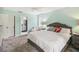 Spacious bedroom includes a comfortable seating area and bathroom access at 106 Waterwood Dr, Yalaha, FL 34797