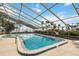 Enclosed community pool providing a refreshing oasis for residents with scenic views of the lake at 106 Waterwood Dr, Yalaha, FL 34797