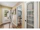 Inviting entryway leading into a bright home office with a desk and a view of the yard at 106 Waterwood Dr, Yalaha, FL 34797