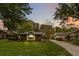 Charming single-story home with a landscaped front yard and inviting curb appeal at dusk at 106 Waterwood Dr, Yalaha, FL 34797