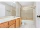 Bathroom features a single sink vanity and tub with shower at 1072 Weaver Dr, Oviedo, FL 32765