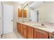 Bathroom featuring a double sink vanity with a large mirror at 1072 Weaver Dr, Oviedo, FL 32765