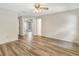 Bedroom with wood floors and a view into another room at 1072 Weaver Dr, Oviedo, FL 32765