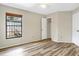 Bright bedroom with wood floors, ceiling fan, and a large window at 1072 Weaver Dr, Oviedo, FL 32765
