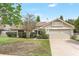 Charming single-Gathering home with a two-car garage and well-maintained front yard landscaping at 1072 Weaver Dr, Oviedo, FL 32765