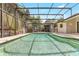 Inviting screened-in pool and spa area perfect for relaxing and entertaining outdoors in privacy at 1072 Weaver Dr, Oviedo, FL 32765