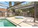 Screened-in pool with spa and patio area, perfect for outdoor entertaining at 1072 Weaver Dr, Oviedo, FL 32765