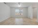 Sunny bedroom offering tile floors, a large window, and a spacious layout at 1101 S Thompson Ave, Deland, FL 32720