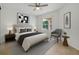 Stylish bedroom with a comfortable bed, chic decor, and ample natural light at 1101 S Thompson Ave, Deland, FL 32720