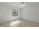 Minimalist bedroom featuring neutral tones, natural light, and tiled flooring, suitable for customization at 1101 S Thompson Ave, Deland, FL 32720