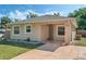 Inviting home with neutral paint, well-placed windows, and a covered front entry at 1101 S Thompson Ave, Deland, FL 32720