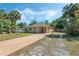 Single-story home with a spacious front yard and a long driveway leading to the entrance at 1101 S Thompson Ave, Deland, FL 32720