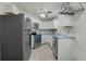 Well-equipped kitchen featuring stainless steel appliances and bright white cabinets at 1101 S Thompson Ave, Deland, FL 32720