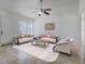 Bright living room featuring tile floors, neutral walls, and lots of natural light at 1101 S Thompson Ave, Deland, FL 32720