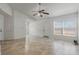 Open living area with tile floors, neutral walls, and a ceiling fan at 1101 S Thompson Ave, Deland, FL 32720