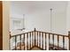 Bright foyer featuring vaulted ceilings, a ceiling fan, and a view of the entry area from the second story at 1117 Indiana Ave, St Cloud, FL 34769