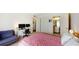 Bedroom featuring a bed, desk, hardwood floors, and ensuite bath at 1140 S Orlando Ave # F-3, Maitland, FL 32751