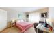 Comfortable bedroom with a bed, a desk, and natural light at 1140 S Orlando Ave # F-3, Maitland, FL 32751