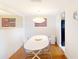 Bright dining room with hardwood floors, a modern light fixture, and seating for four at 1140 S Orlando Ave # F-3, Maitland, FL 32751