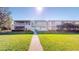 Exterior of condo building with lush green lawn and a walkway leading to the entrance at 1140 S Orlando Ave # F-3, Maitland, FL 32751