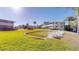Exterior of the condo buildings with a putting green and chairs for outdoor relaxation at 1140 S Orlando Ave # F-3, Maitland, FL 32751