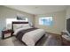 Staged main bedroom showcases natural light, wood-look floors, and neutral tones at 11507 Lake Dr, Leesburg, FL 34788