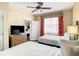 Comfortable bedroom with twin beds, ceiling fan, and a view into the second bedroom at 12544 Floridays Resort Dr # 102, Orlando, FL 32821