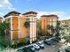 Beautiful resort condo community with Spanish-tile roofs and mature landscaping at 12544 Floridays Resort Dr # 102, Orlando, FL 32821