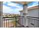 Balcony overlooking a scenic neighborhood with well-maintained homes and lush landscaping at 13628 Abberwick Dr, Orlando, FL 32832