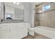 Well-lit bathroom features a glass shower and white vanity at 13628 Abberwick Dr, Orlando, FL 32832