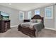 Comfortable bedroom with a large bed, shutters, and a TV at 13628 Abberwick Dr, Orlando, FL 32832