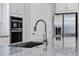Close up on kitchen island with granite countertop, stainless steel faucet, and appliances at 13628 Abberwick Dr, Orlando, FL 32832