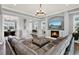 Spacious living room featuring a fireplace and comfortable leather seating at 13628 Abberwick Dr, Orlando, FL 32832