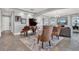 Open concept living room featuring a grand piano, fireplace, and comfortable seating area at 13628 Abberwick Dr, Orlando, FL 32832