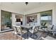 Inviting covered patio with elegant outdoor seating, ideal for relaxing or entertaining guests at 13628 Abberwick Dr, Orlando, FL 32832