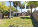 Spacious backyard featuring a screened pool enclosure, perfect for outdoor entertaining and relaxation at 1404 Barcelona Ct, Winter Springs, FL 32708