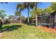 Expansive backyard with lush lawn and screened-in pool area, ideal for outdoor activities and relaxation at 1404 Barcelona Ct, Winter Springs, FL 32708