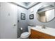 Bathroom featuring gray walls, white vanity, toilet, and shower at 1404 Barcelona Ct, Winter Springs, FL 32708