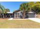 Charming single-story home with a lush lawn and mature landscaping, offering great curb appeal at 1404 Barcelona Ct, Winter Springs, FL 32708