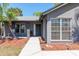 Inviting front entrance with well-maintained landscaping and modern exterior lighting at 1404 Barcelona Ct, Winter Springs, FL 32708