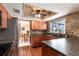 The kitchen features wood cabinets, stainless appliances, and a pass-through to the dining area at 1404 Barcelona Ct, Winter Springs, FL 32708