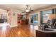 Open floor plan showcasing the kitchen, dining area, and sliding glass doors to the outdoor pool at 1404 Barcelona Ct, Winter Springs, FL 32708