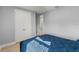 Neutral-toned bedroom featuring a storage closet with mirrored doors offering both space and privacy at 14399 Wabasso Loop, Winter Garden, FL 34787