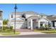 Beautiful two-story home featuring a well-manicured lawn, a two-car garage, and a welcoming front porch at 14399 Wabasso Loop, Winter Garden, FL 34787