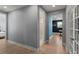 Hallway offers views of a bathroom and a game room, providing easy access to different parts of the home at 14399 Wabasso Loop, Winter Garden, FL 34787