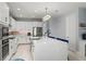 The spacious kitchen boasts a large center island, stainless steel appliances, and ample cabinet space at 14399 Wabasso Loop, Winter Garden, FL 34787